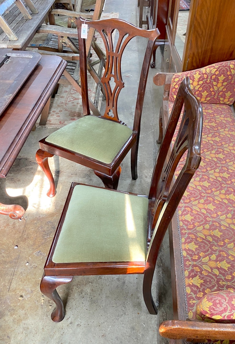 A set of four early 20th century Chippendale style mahogany dining chairs